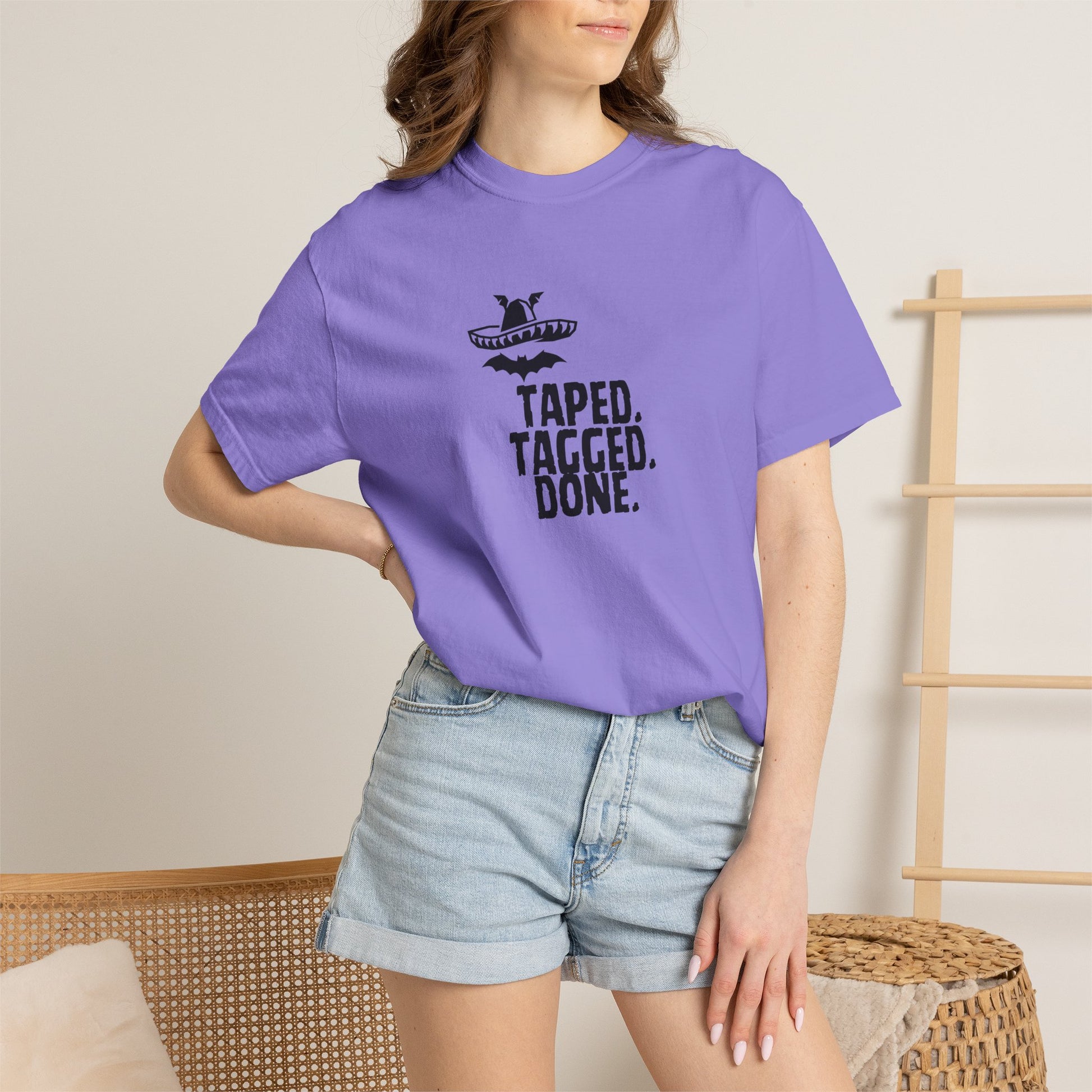 Model leaning against brick wall wearing The Midnight Mariachi vintage wash graphic shirt
