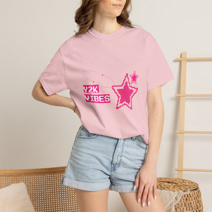 Model wearing Y2K retro graphic tee tucked into low-rise mini skirt — early 2000s aesthetic outfit