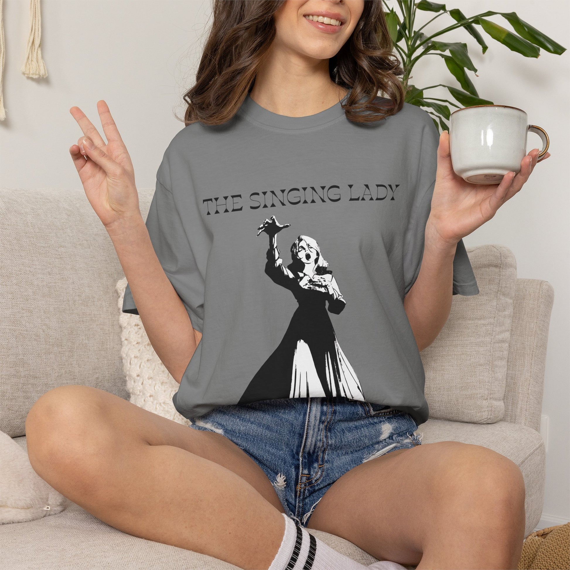 Monochrome graphic tee paired with denim for a casual gothic look
