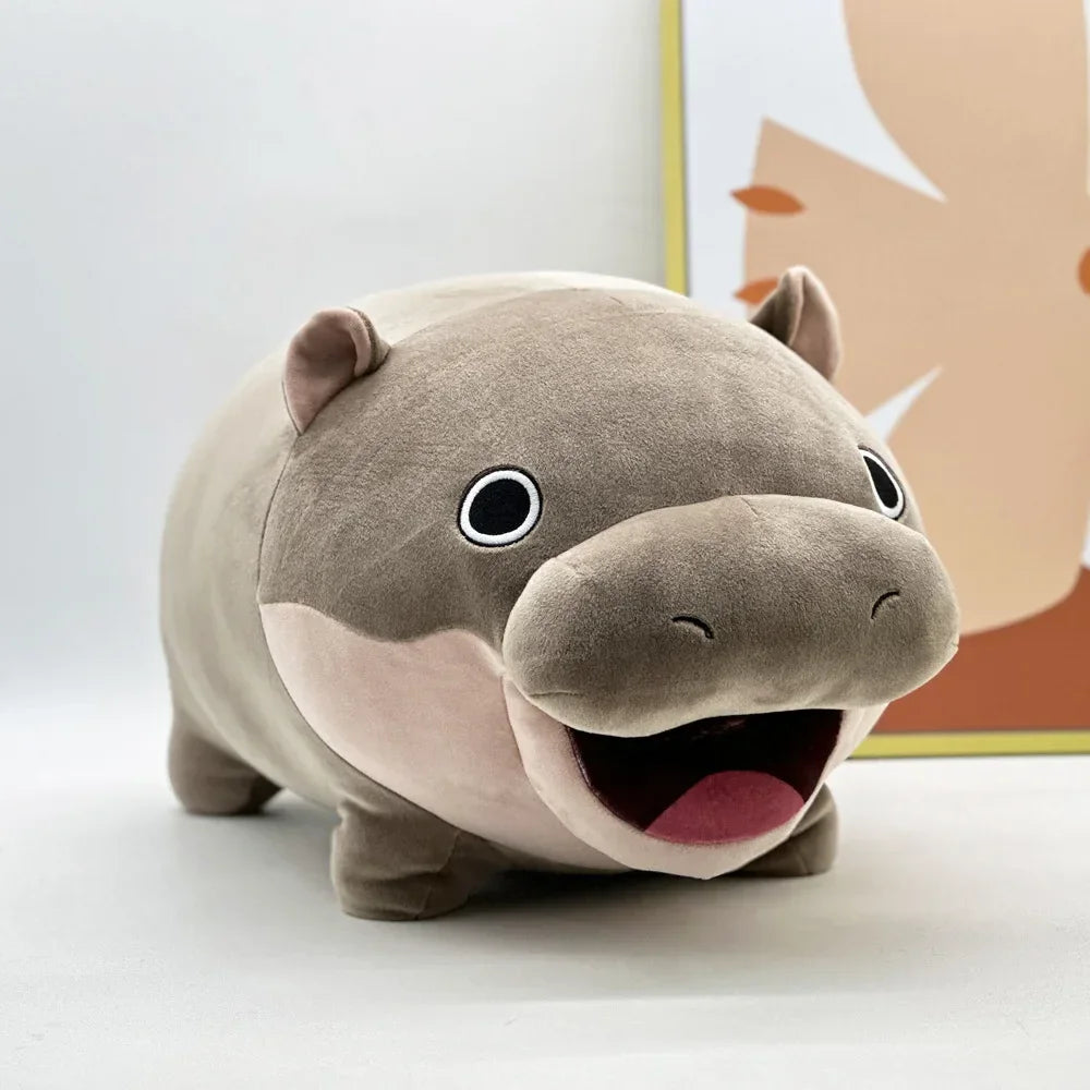 Moo Deng plush held in two hands to show scale, compact cuddly size ideal for display or gifting
