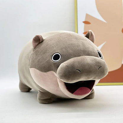 Moo Deng plush held in two hands to show scale, compact cuddly size ideal for display or gifting
