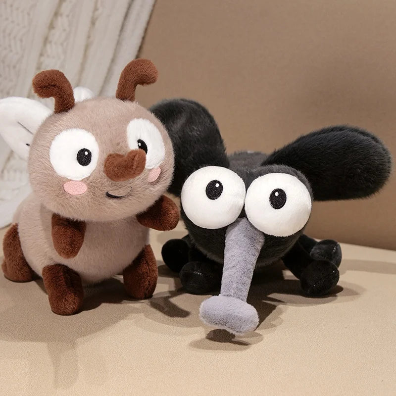 Mosquito plushie Buzzy Brown held in hand to show scale 20cm