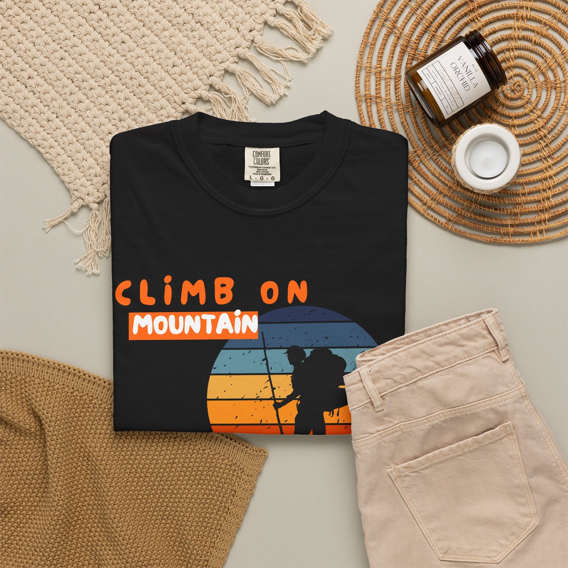 Mountain climbing gift shirt displayed on neutral background with bold peak silhouette print