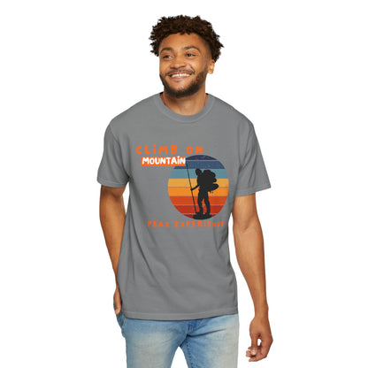 Mountaineer apparel lifestyle photo: climber wearing Peak Experience graphic tee at trail head
