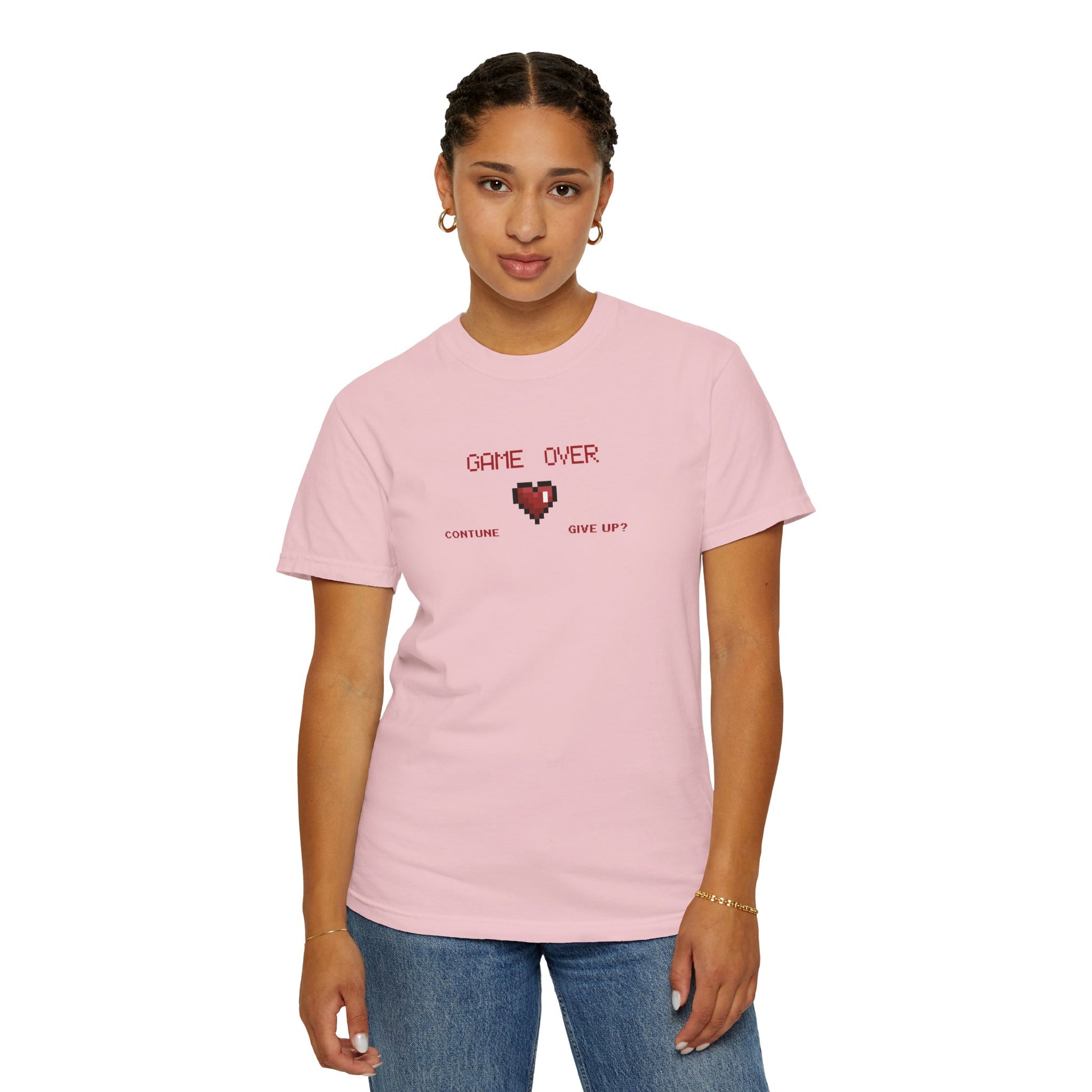 Multiple folded indie gamer shirts in a row showing available garment dyed colorway variety in a clean styled display
