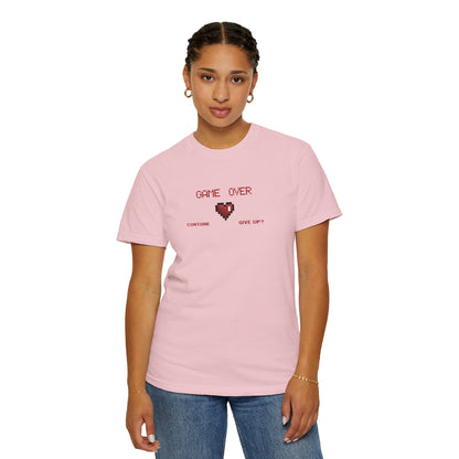 Multiple folded indie gamer shirts in a row showing available garment dyed colorway variety in a clean styled display
