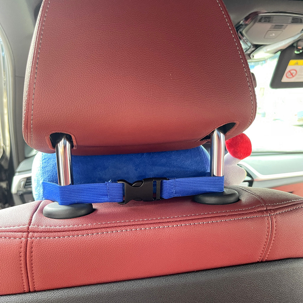NOS bottle plush toy displayed on gaming desk next to car memorabilia
