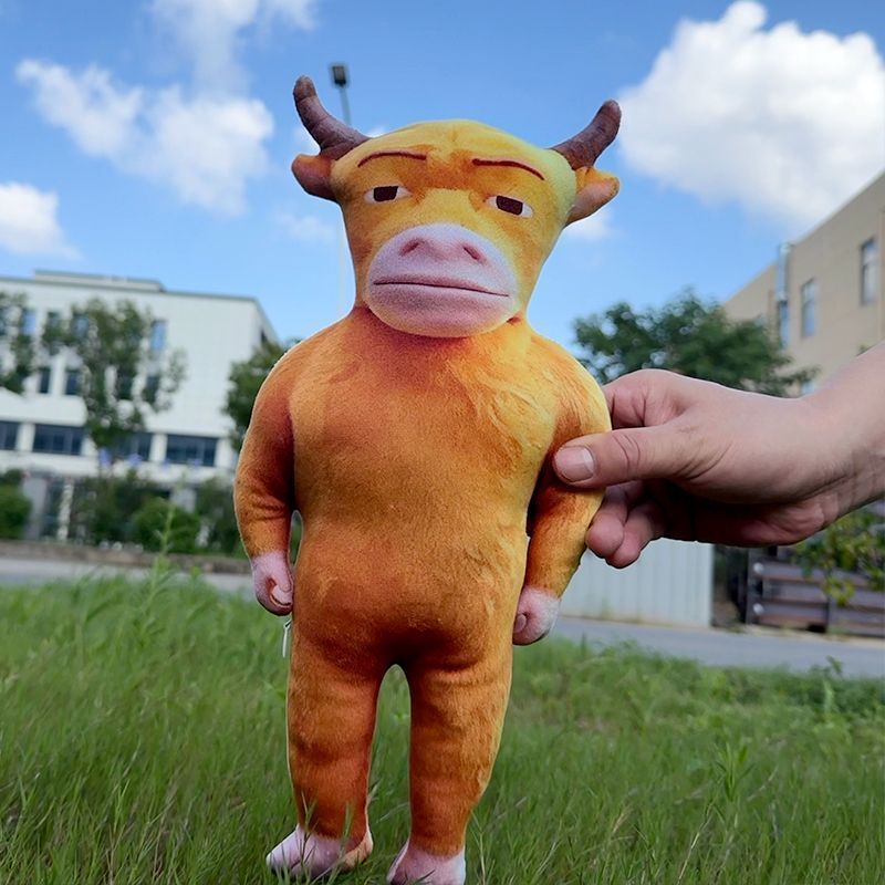 Niu Lai meme cow plush standing on shelf with collectibles