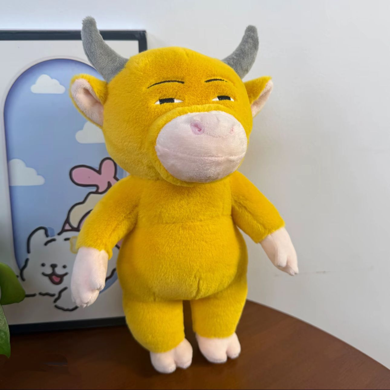 Niu Lai stuffed toy front view showing iconic blank cow face
