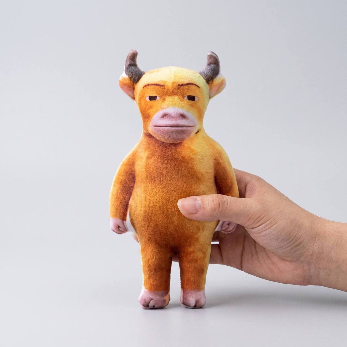 Niu Lai unhinged muscular cow plush close up face detail