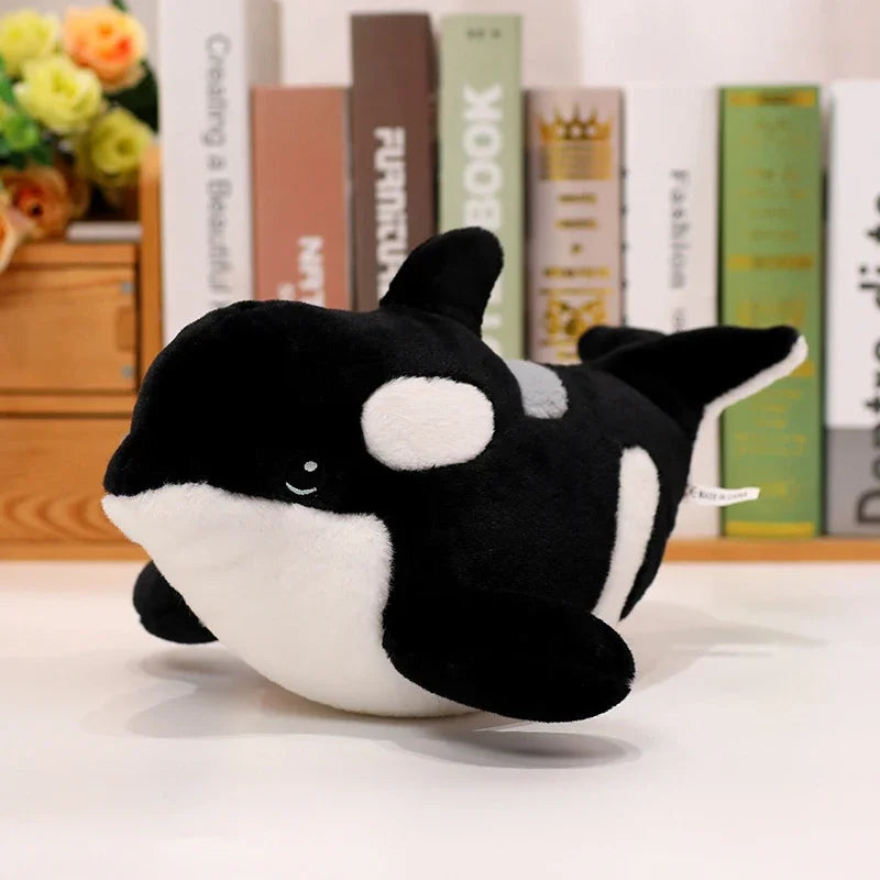 Orca stuffed toy showing black and white cartoon design close-up