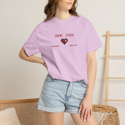 Overhead flat shot of game over shirt spread on a light textured linen surface showing full front body and graphic placement
