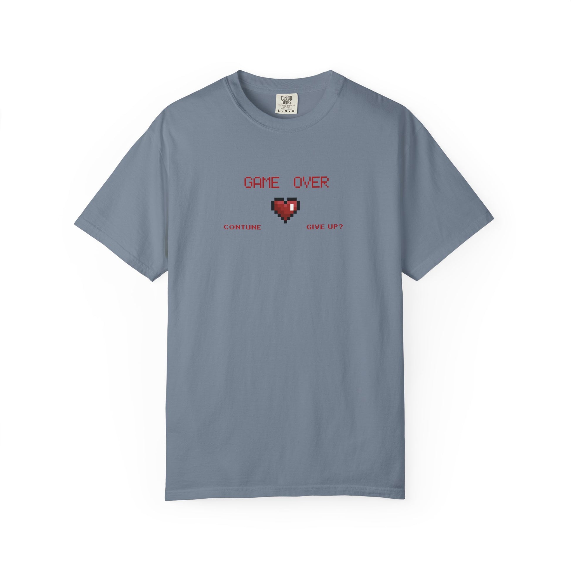 Overhead folded flat lay of game over shirt showing soft garment dyed fabric and collar detail in natural light
