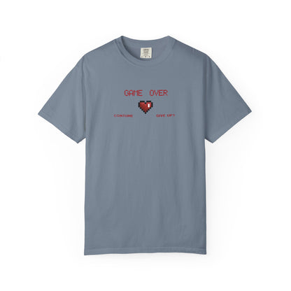 Overhead folded flat lay of game over shirt showing soft garment dyed fabric and collar detail in natural light
