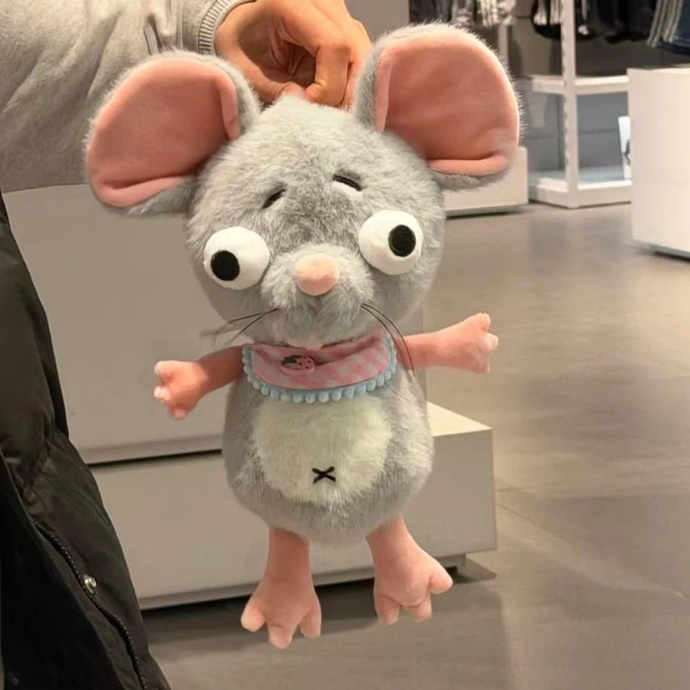 Oversized ear detail on gray mouse stuffed toy, dramatic proportions for comedic effect