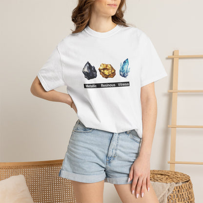 Person wearing crystal luster graphic tee while rockhounding outdoors