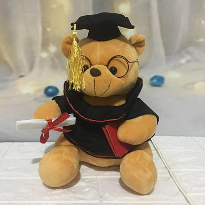 Pink graduate bear displayed on shelf as a graduation keepsake gift
