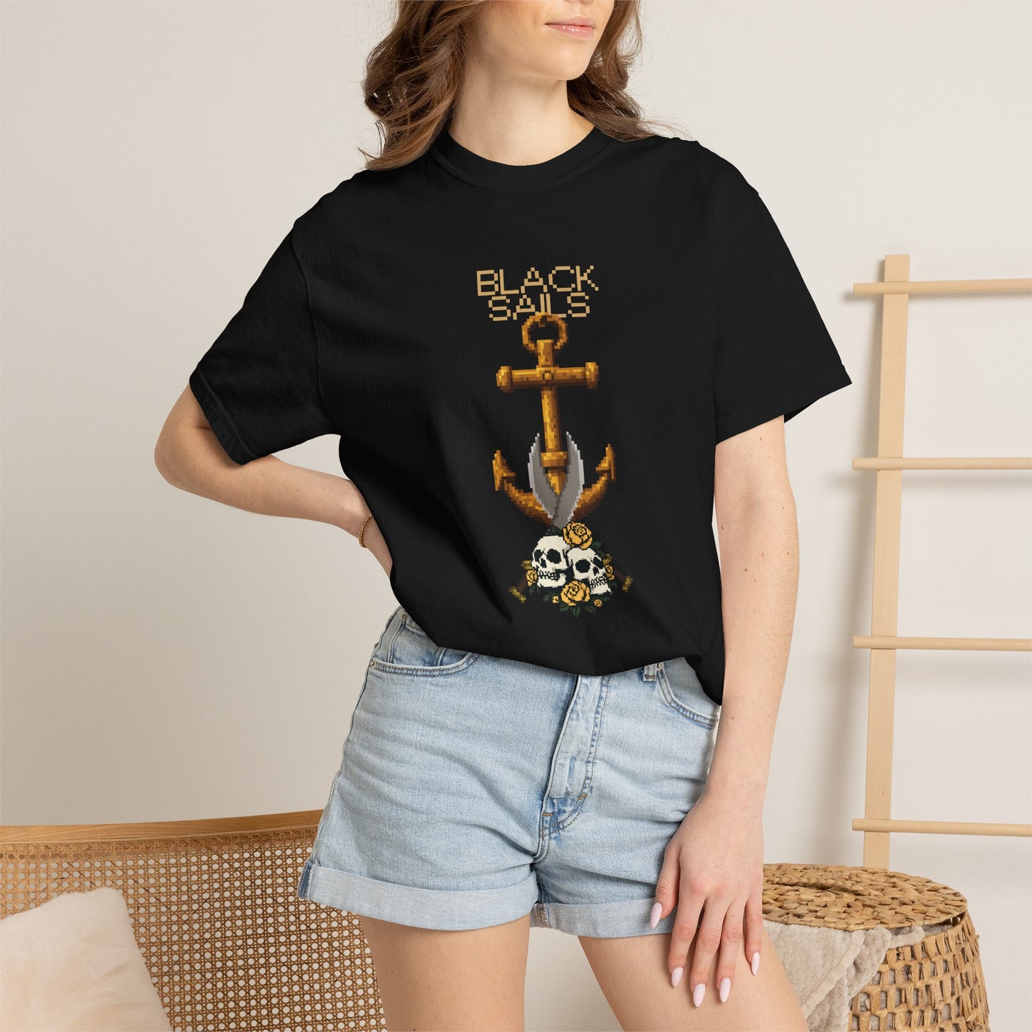 Pixel art tee with twin skulls and yellow roses shot on dark matte background
