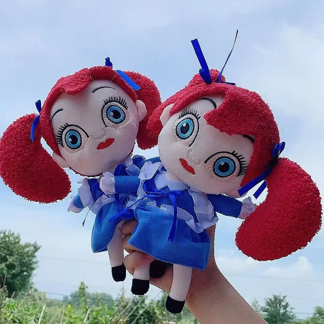 Poppy stuffed plush with red pigtails and blue dress front view
