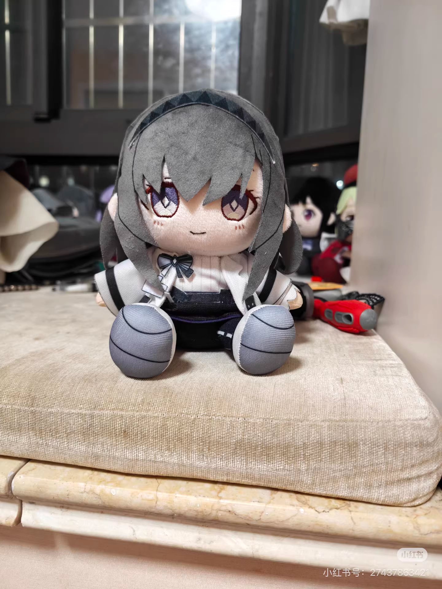Priestess Arknights stuffed toy showing detailed face and brown hair design