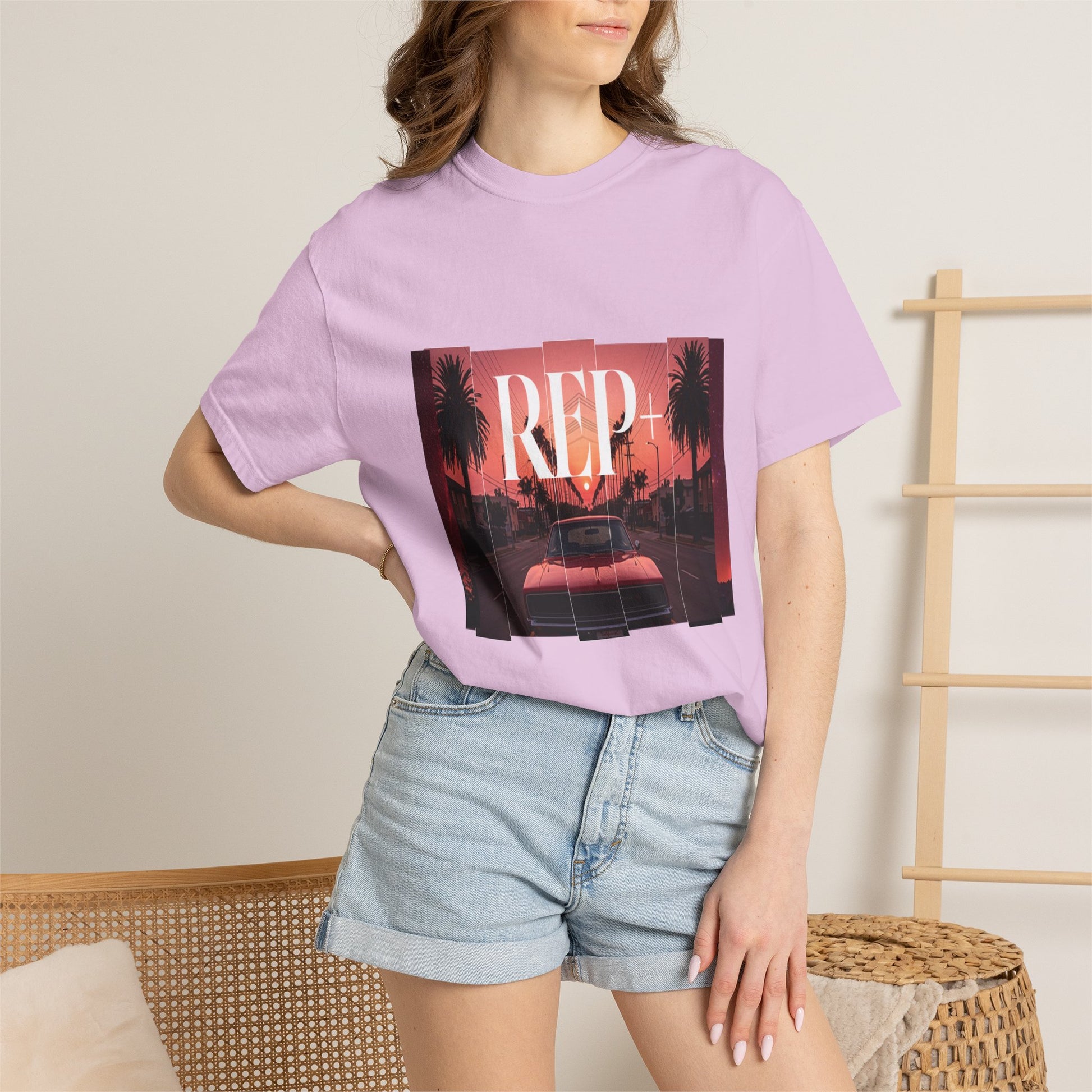 REP+ tee featuring low-slung red car and cinematic outrun-style evening backdrop