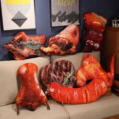 Plush pillows shaped like roasted meats on a couch with decorative wall art in the background.
