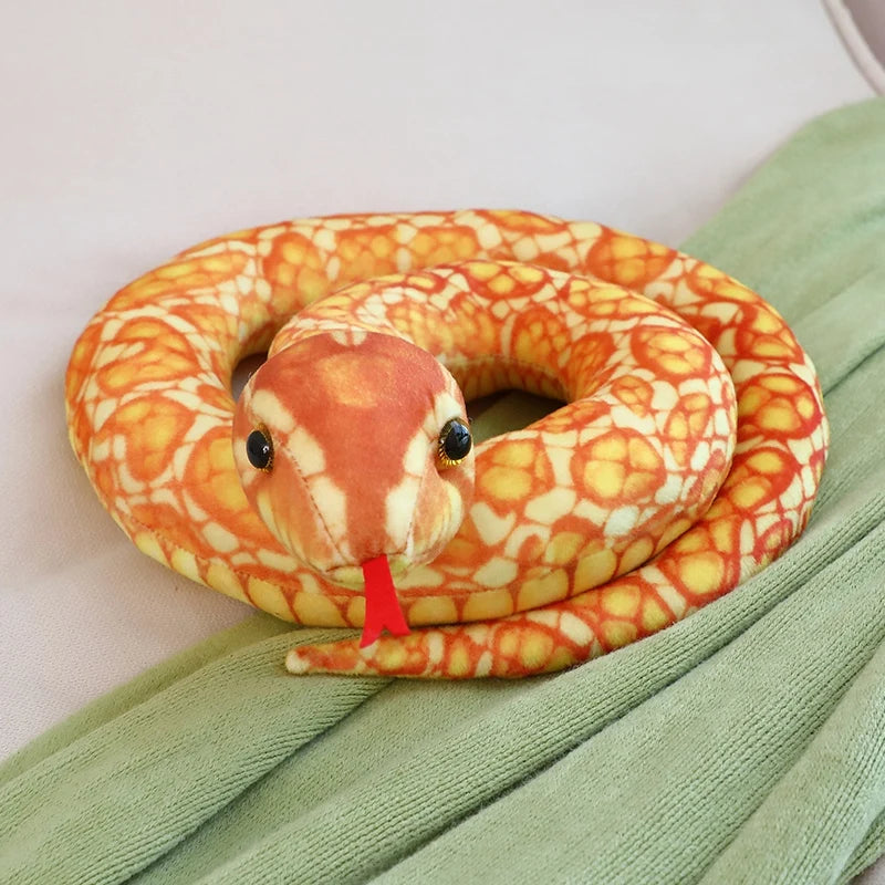 Realistic python plush flexible body posed and coiled on floor