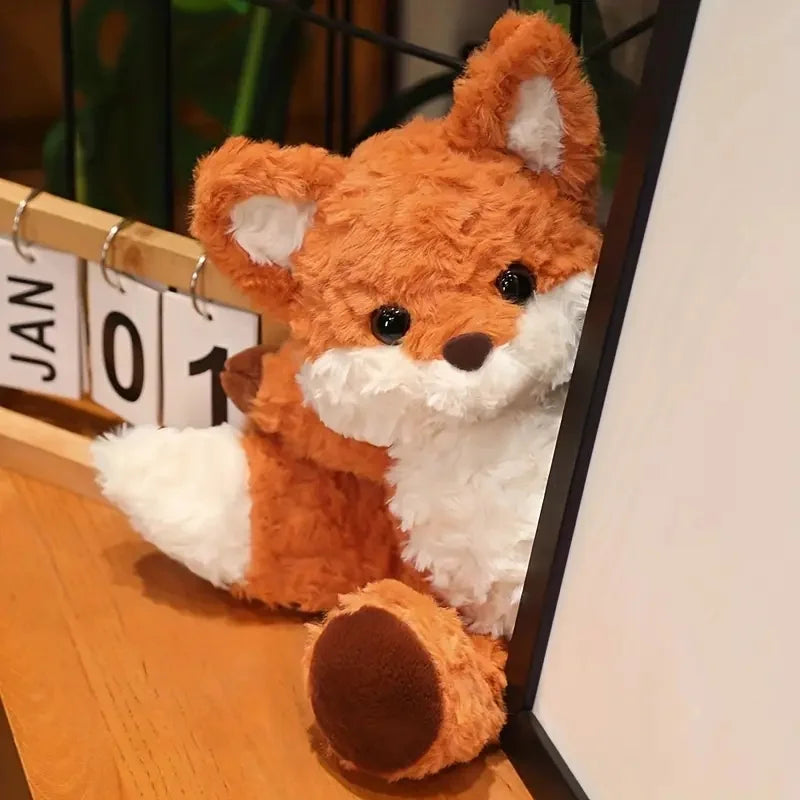 Red fox plushie held in hands showing size comparison