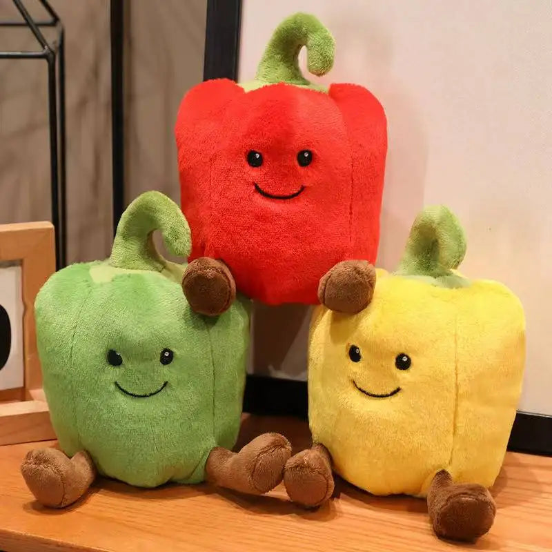 Red smiling bell pepper plushie on clean white background