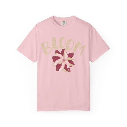 Retro floral graphic tee styled with high-waisted wide-leg jeans and white sneakers