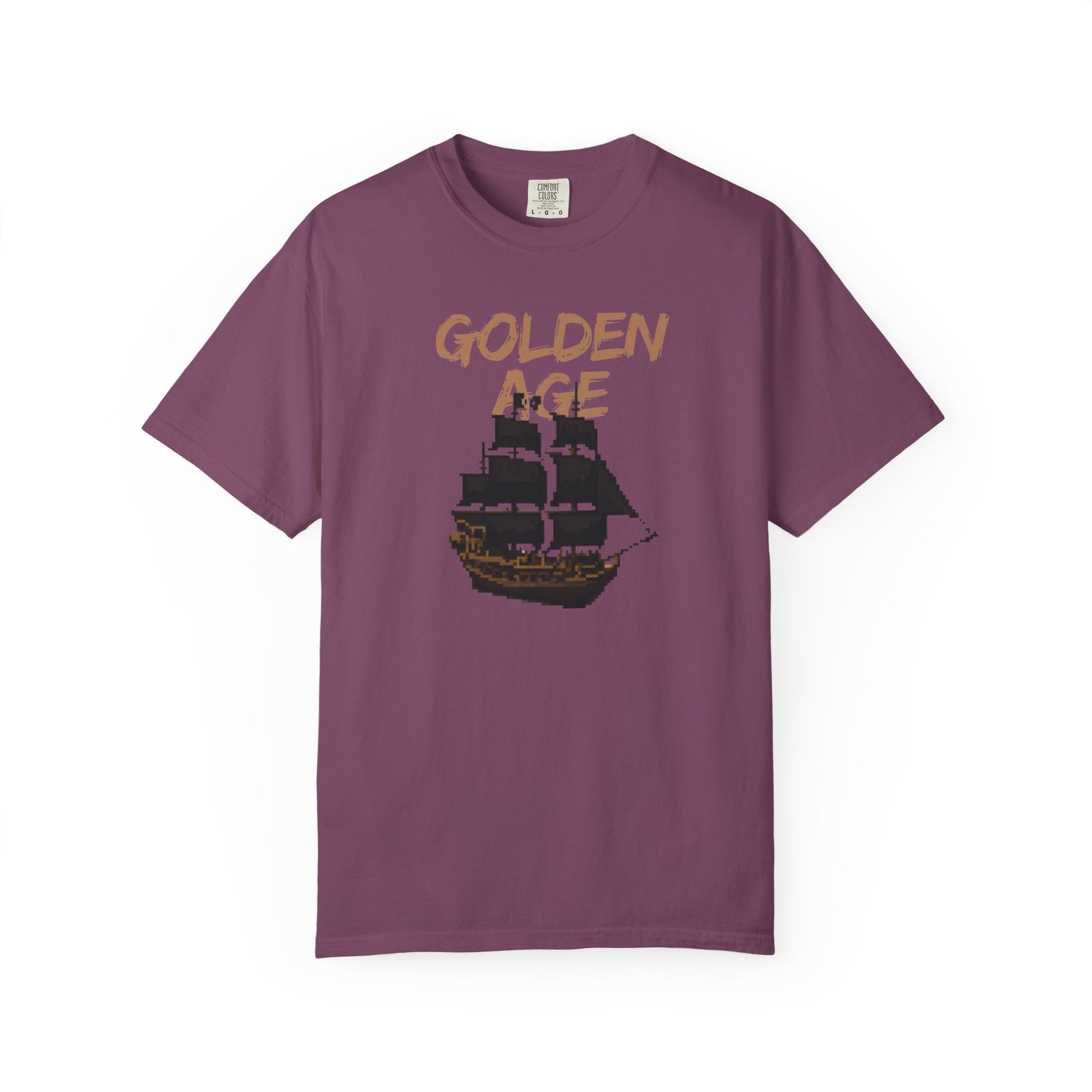 Retro gaming apparel ocean adventure tee on a model in an outdoor coastal setting

