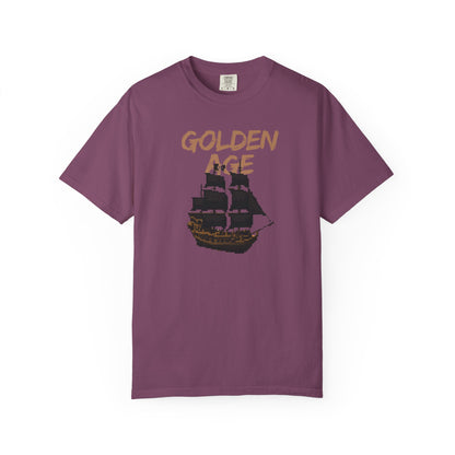 Retro gaming apparel ocean adventure tee on a model in an outdoor coastal setting
