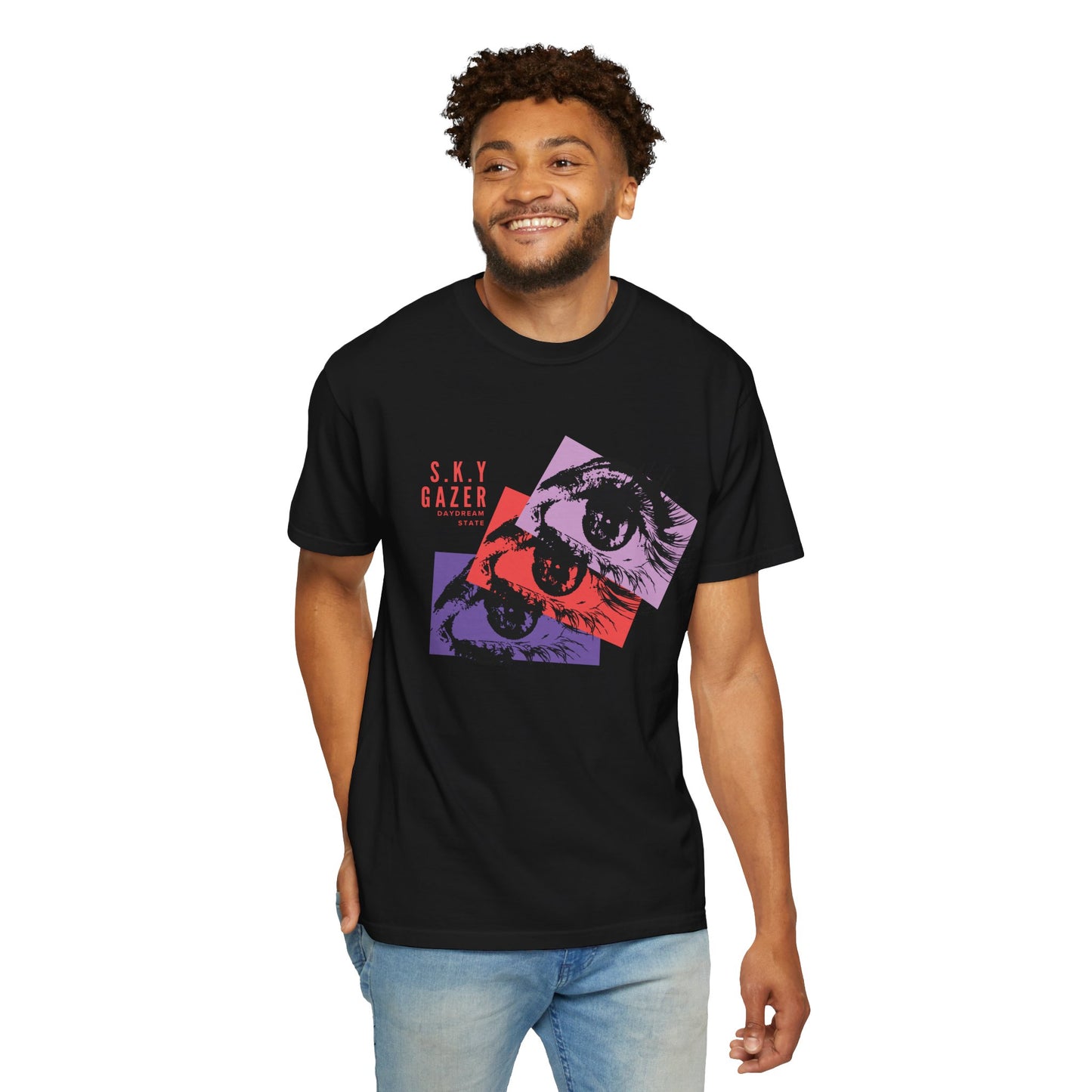 Retro pop art eye tee close up flat lay showing washed purple and red color tones in daylight