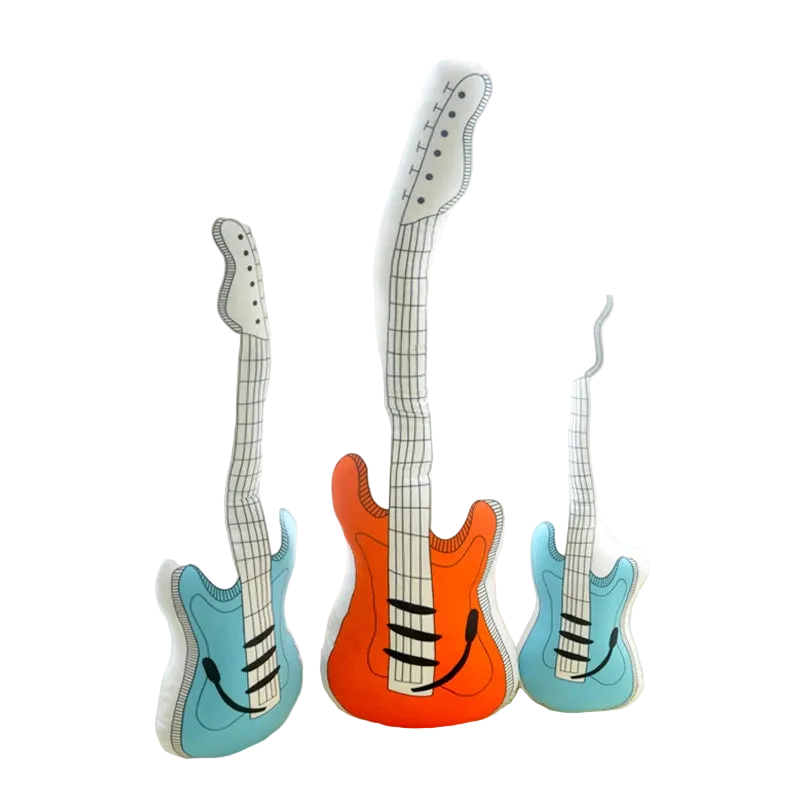 Reversible electric guitar plush pillow in blue color displayed on bedroom shelf