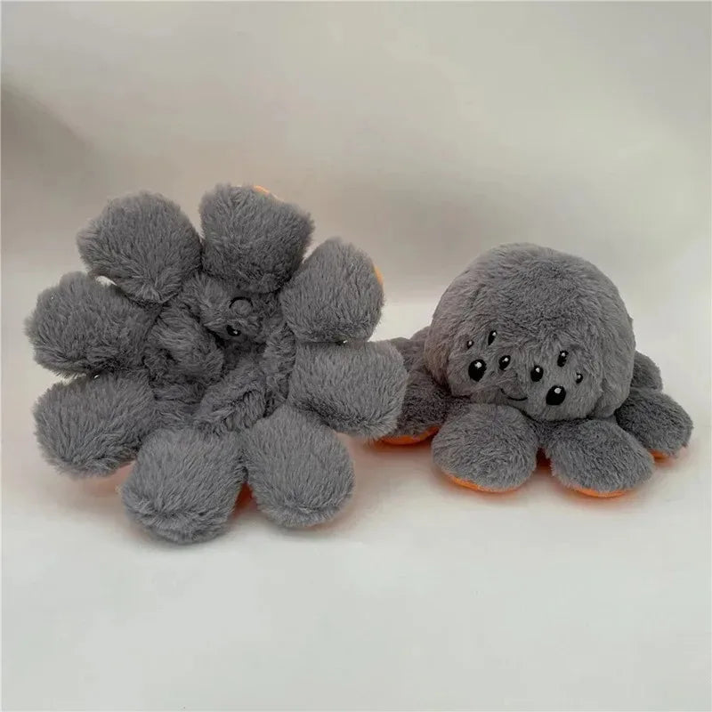 Reversible pumpkin plush shown mid flip revealing the gray spider stuffed toy inside, handmade Halloween mood plushie