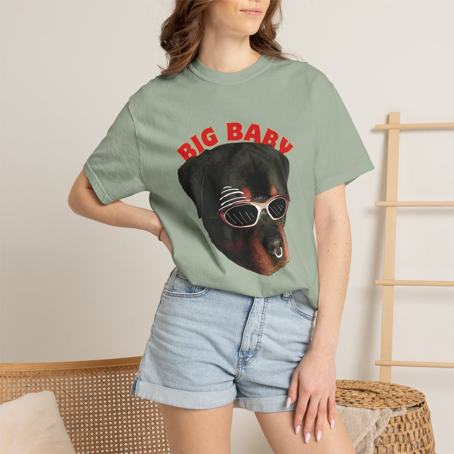 Rottie owner gift tee lifestyle shot at dog park with Rottweiler in background