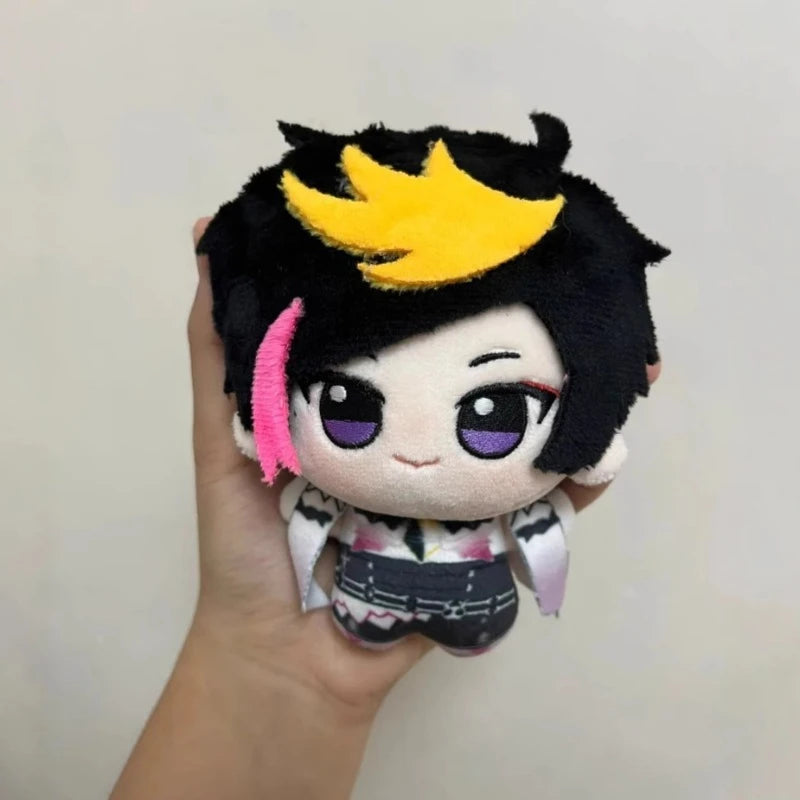 Shu Yamino chibi plush keychain displayed on a desk shelf alongside other VTuber chibi plush collectibles, fanmade anime chibi keychain