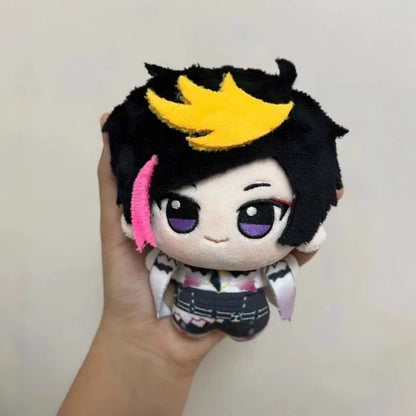 Shu Yamino chibi plush keychain displayed on a desk shelf alongside other VTuber chibi plush collectibles, fanmade anime chibi keychain