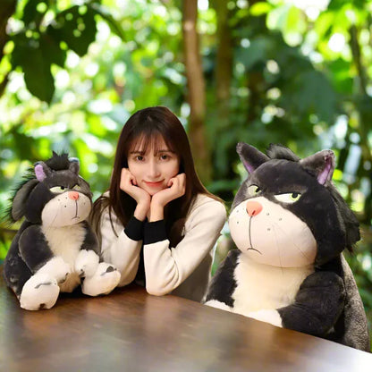 Side-eyeing cat plush doll in living room - adds charm to home decor.