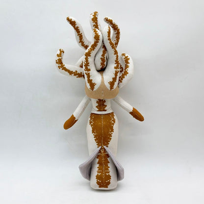 Sea monster stuffed animal mermaid displayed on shelf as collectible decor