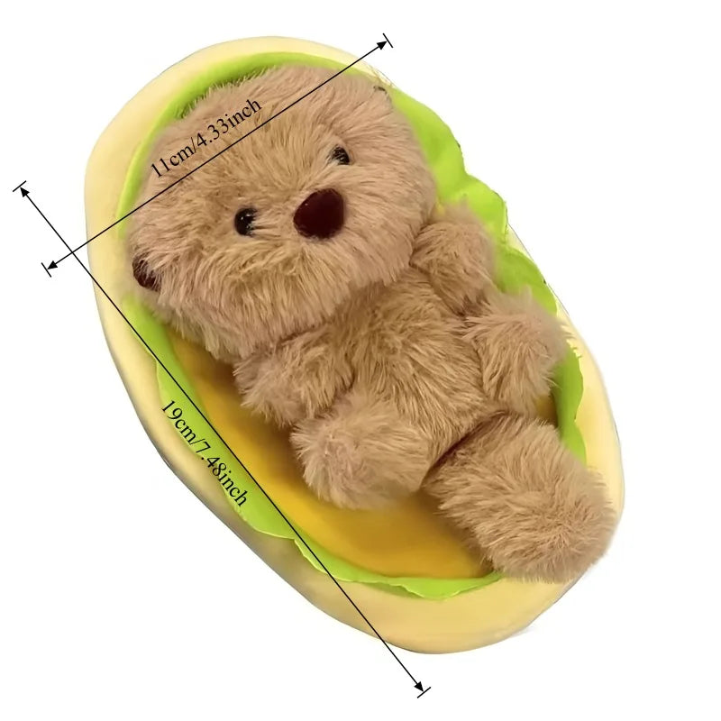 Sea otter plush desk buddy on bookshelf display