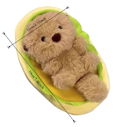 Sea otter plush desk buddy on bookshelf display