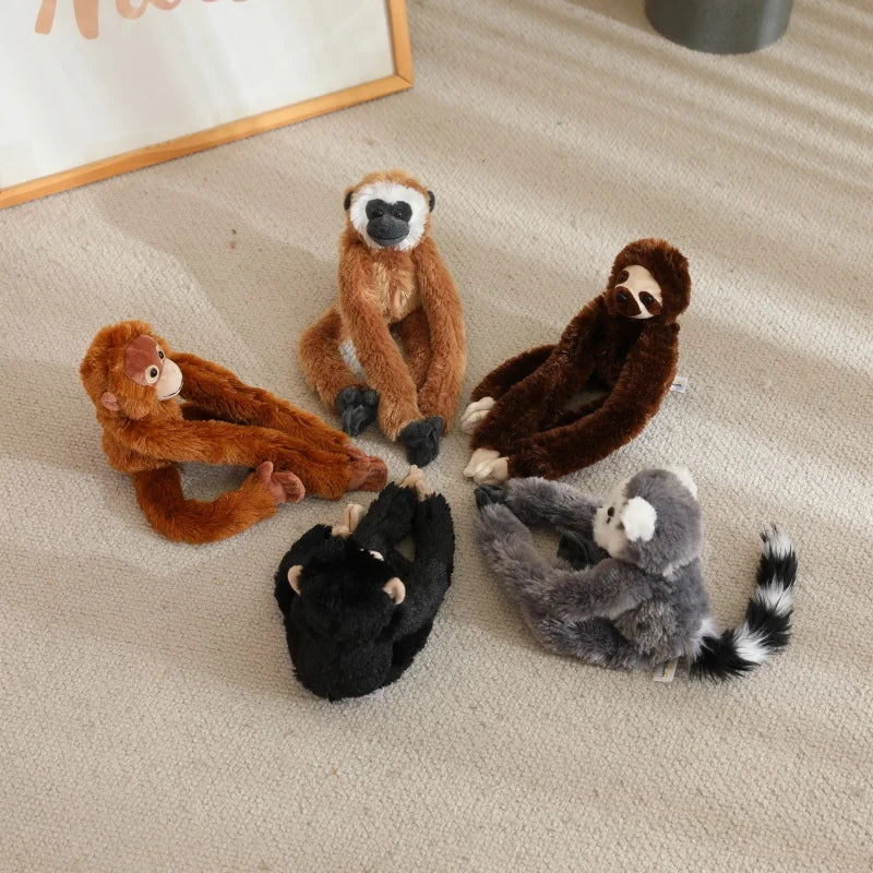 Set of jungle animal plushies including chimpanzee, gorilla, sloth and lemur