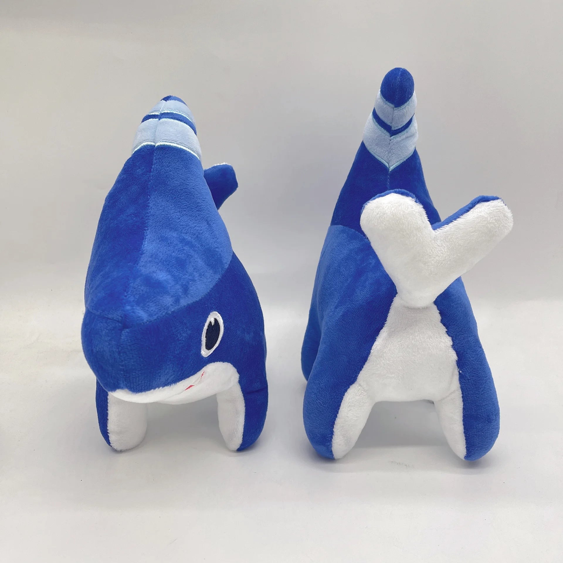 Sharkdog plush toy size comparison with hand