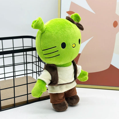 Shrek aesthetic plush sitting on a bed for room decor