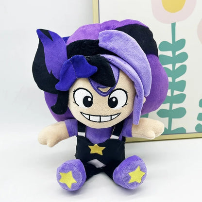 Side profile of the Gracie Green plush featuring the star logo.