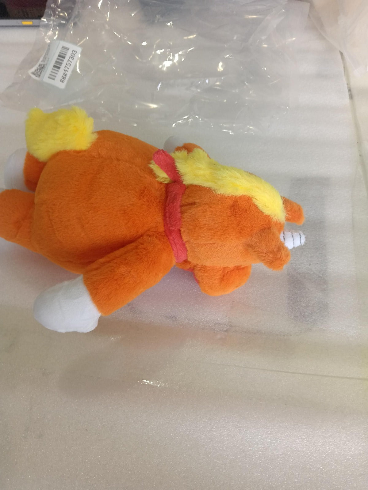 Side_profile_of_the_creepy-cute_Buddy_the_Unicorn_plushie_showing_its_signature_unicorn_horn_and_mane_supplier_photo.