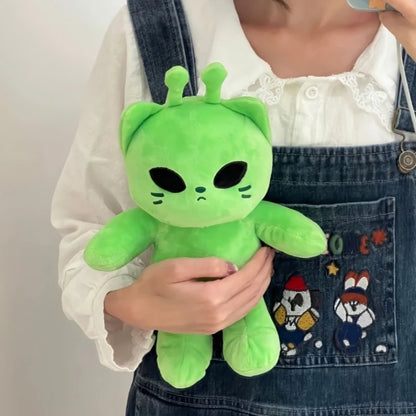 Side view of the 22cm plush alien cat cushion