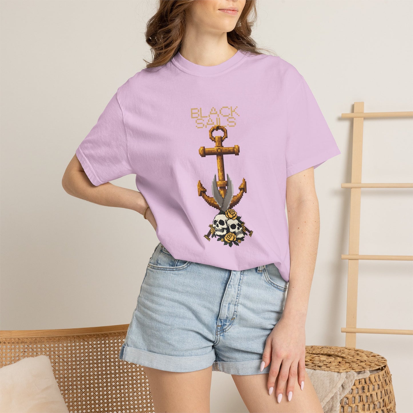 Skull anchor tee styled on coat hanger with studio lighting showing color depth
