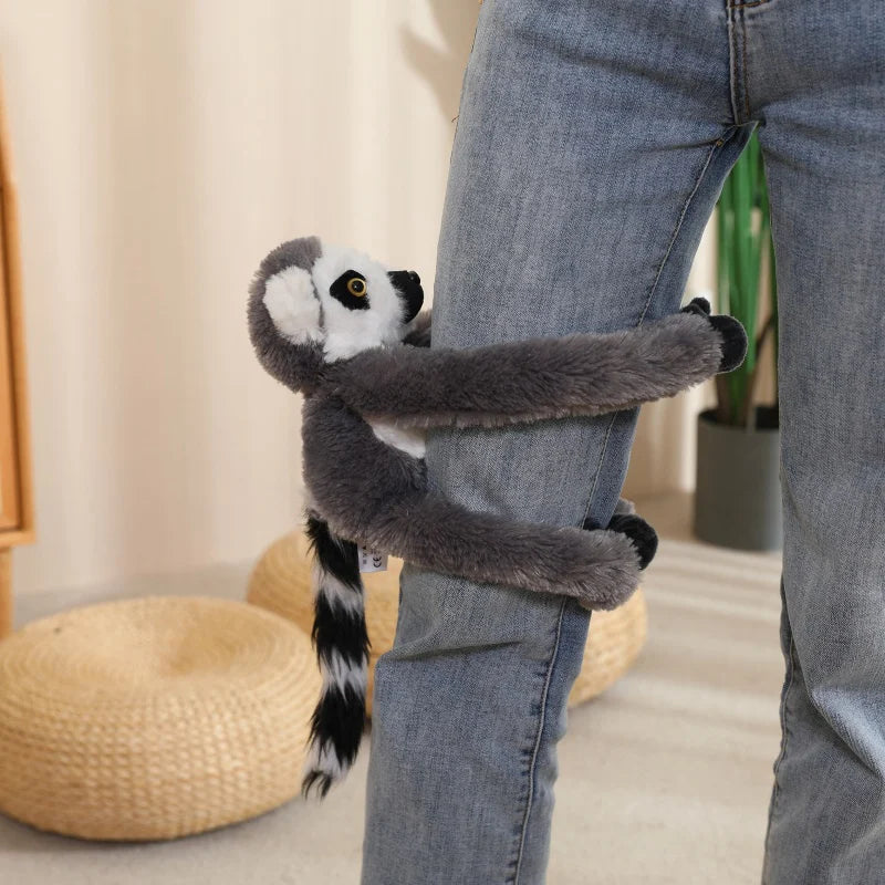 Sloth plushie with long arms clinging to a bag strap, handmade cotton plush